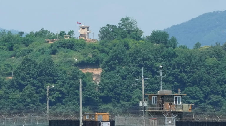 A North Korean military guard post, top, and South Korean...