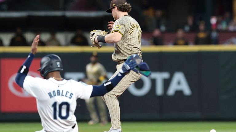 Seattle Mariners' Victor Robles slides into second as San Diego...