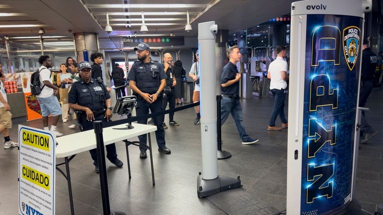 Gun detection machines are tested at the Fulton Street transit...