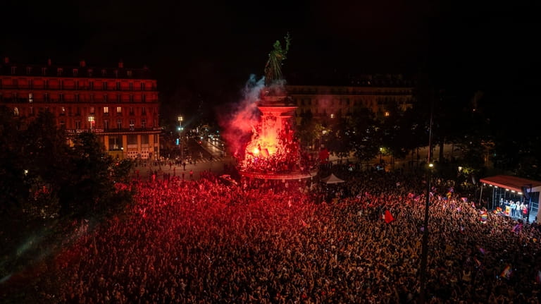 People gather at Republique plaza to protest the far-right National...