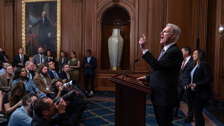 Speaker of the House Kevin McCarthy, R-Calif., pauses as he...