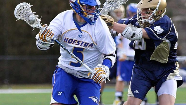 Hofstra midfielder Steve Serling moves the ball into the Notre...