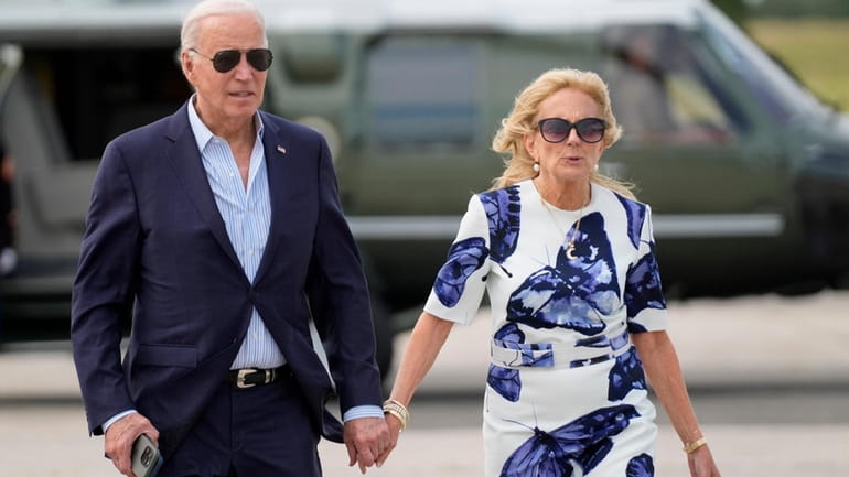 President Joe Biden, left, and first lady Jill Biden arrive...