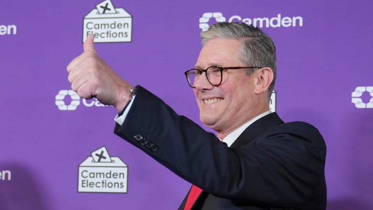 Britain's Labour Party leader Keir Starmer gives a thumbs up...