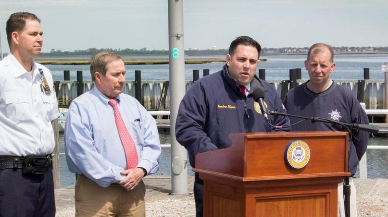 Hempstead Bay Constable Sgt. Matthew Sohm, left, Thomas Doheny, commissioner...