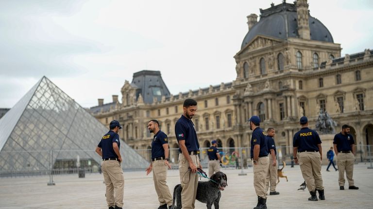 Members of the United Arab Emirates security team patrol a...