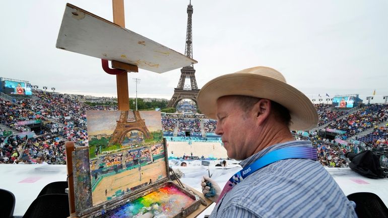 Peter Spens, of London, England, paints the scene at Eiffel...