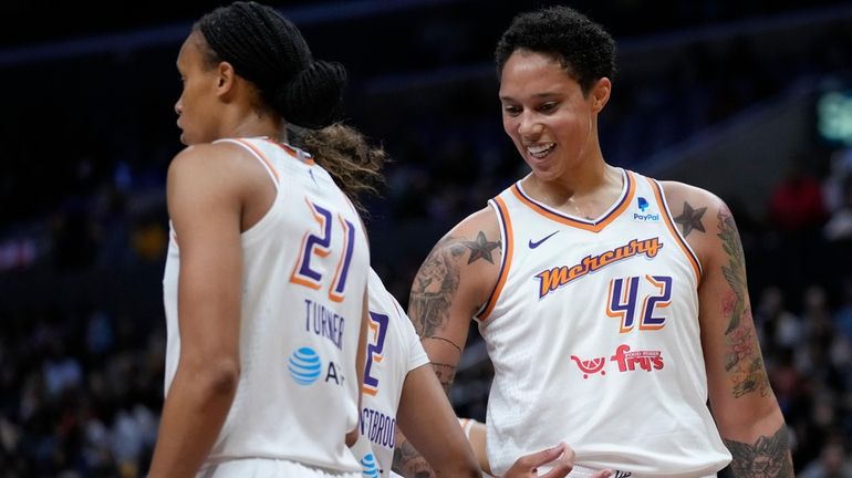 Phoenix Mercury center Brittney Griner (42) celebrates a foul with...