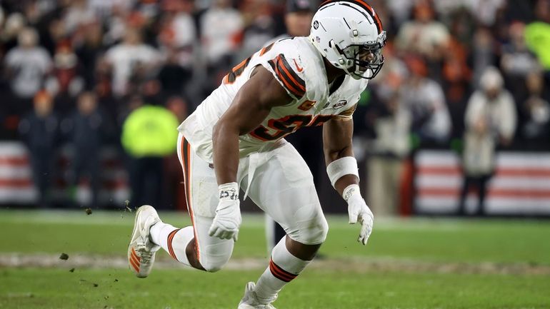 Cleveland Browns defensive end Myles Garrett (95) runs off of...