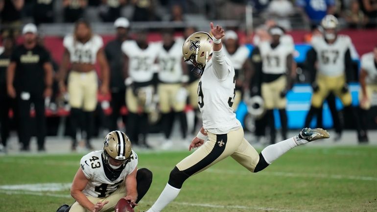 New Orleans Saints place kicker Charlie Smyth kicks the game...