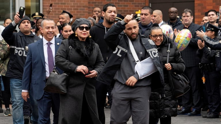 NYPD Lt. Jose Gautreaux gives a thumbs up as he's...