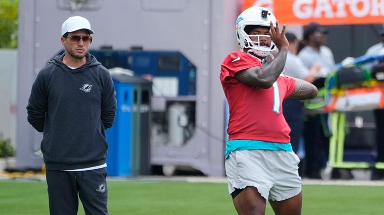 Miami Dolphins head coach Mike McDaniel watches quarterback Tua Tagovailoa...