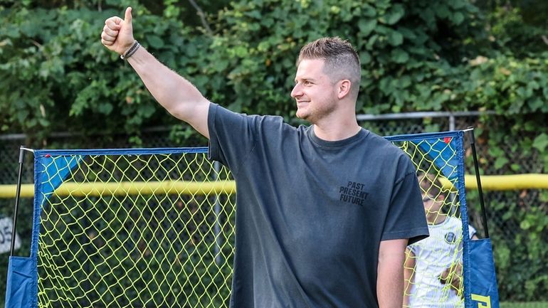 Yankees pitcher Clarke Schmidt conducts a baseball clinic in Massapequa...