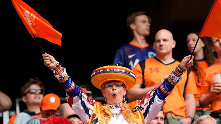 Fans of Netherlands react ahead of a round of sixteen...