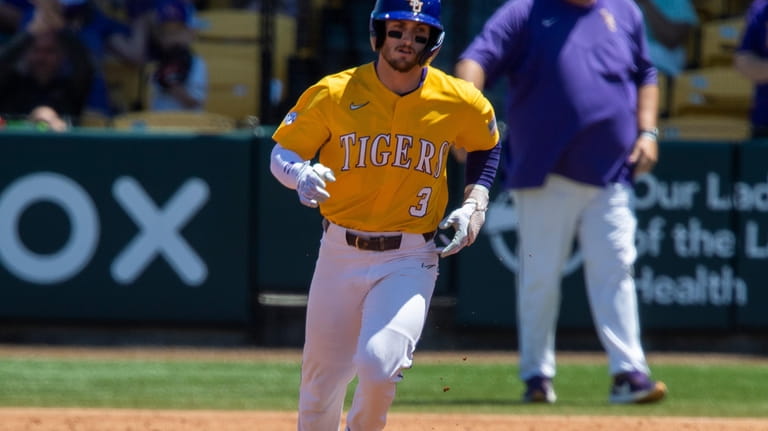 LSU center fielder Dylan Crews (3) rounds the bases following...