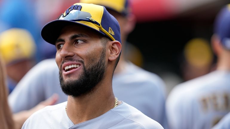 Milwaukee Brewers' Abraham Toro stands in the dugout during the...