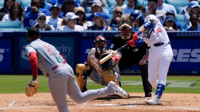 Los Angeles Dodgers' Andy Pages, right, hits a two-run home...