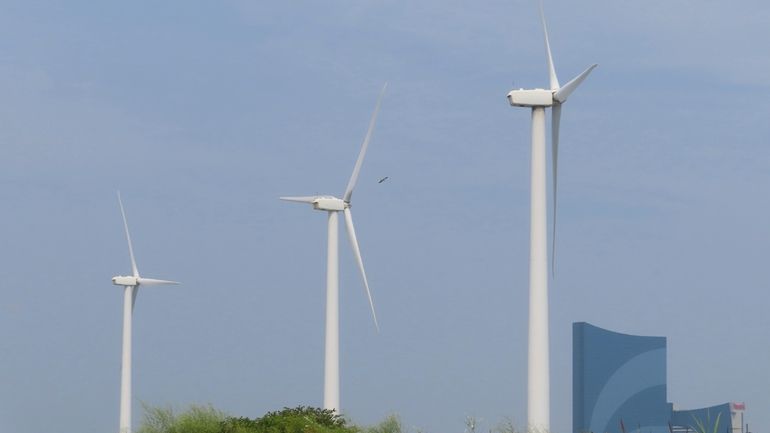 Land-based wind turbines spin in Atlantic City N.J. on July...