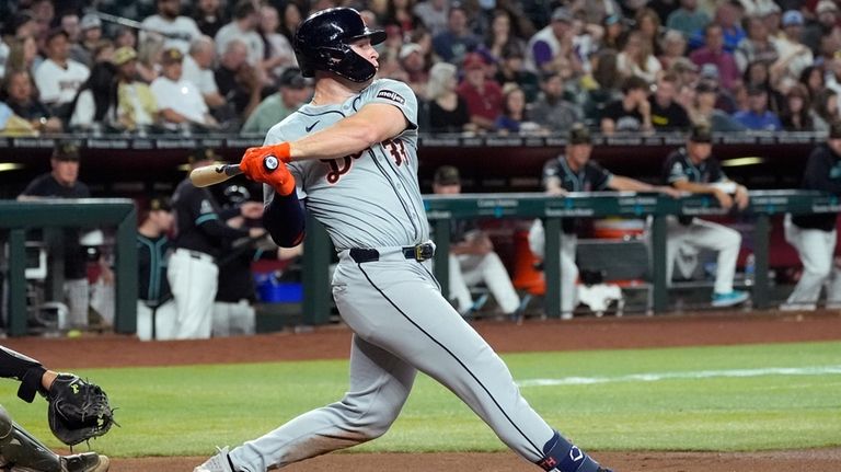 Detroit Tigers' Colt Keith connects for a run-scoring single against...