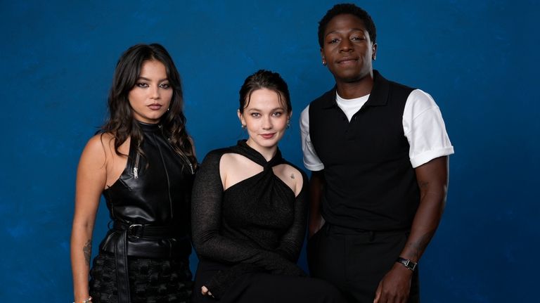 Isabela Merced, from left, Cailee Spaeny, and David Jonsson pose...