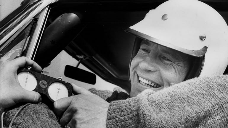 Parnelli Jones smiles after he won the pole for the...