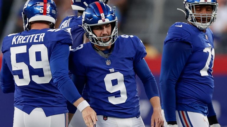 New York Giants place kicker Graham Gano (9) celebrates after...