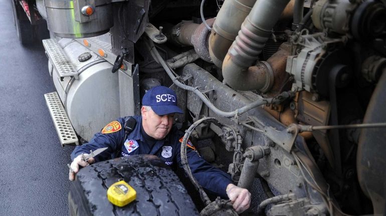 Police Officer Robert Copozzi of the Suffolk County Highway Patrol...