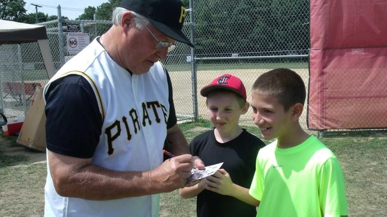 Former Pittsburgh Pirate Fred Cambria, 65, signs autographs for fans...