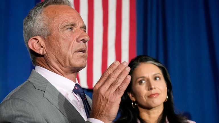 Former Independent candidate for president Robert F. Kennedy, Jr., left,...