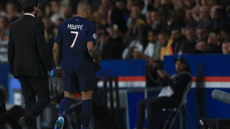 PSG's Kylian Mbappe leaves the pitch with an injury during...