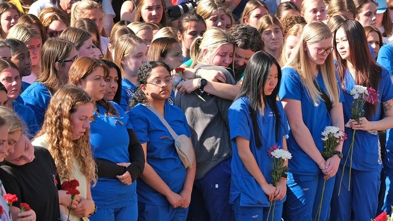 Augusta University students, in blue, and University of Georgia students...