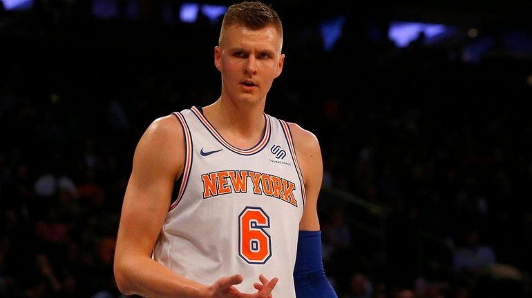 Kristaps Porzingis of the Knicks reacts after a play in...