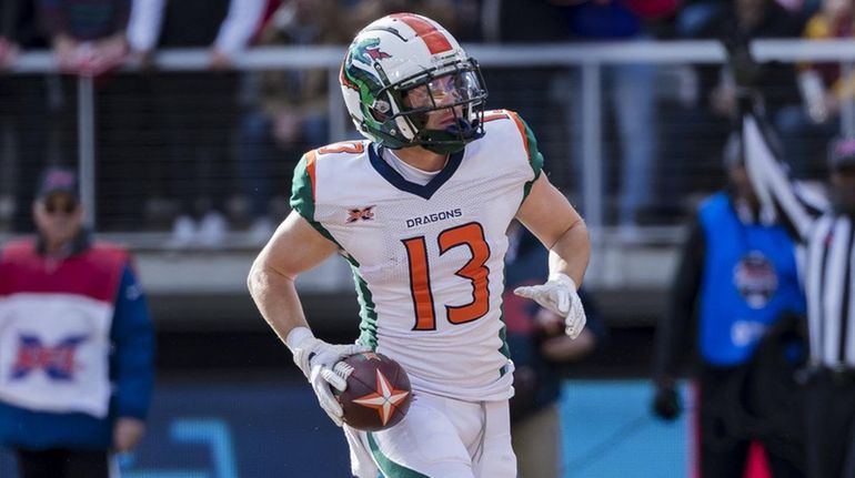 Austin Proehl of the Seattle Dragons scores the first touchdown in...