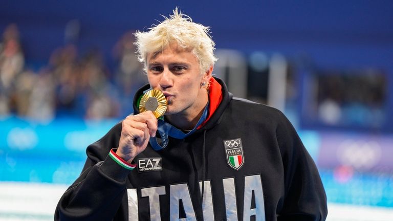 Gold medalist, Nicolo Martinenghi, of Italy, poses after the men's...