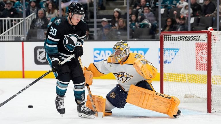 Nashville Predators goaltender Juuse Saros (74) blocks a shot by...