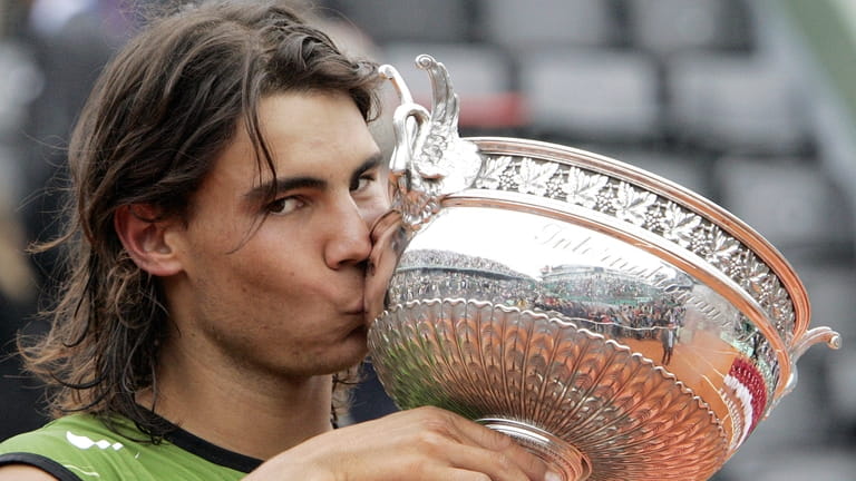 Spain's Rafael Nadal kisses the trophy after defeating Argentina's Mariano...