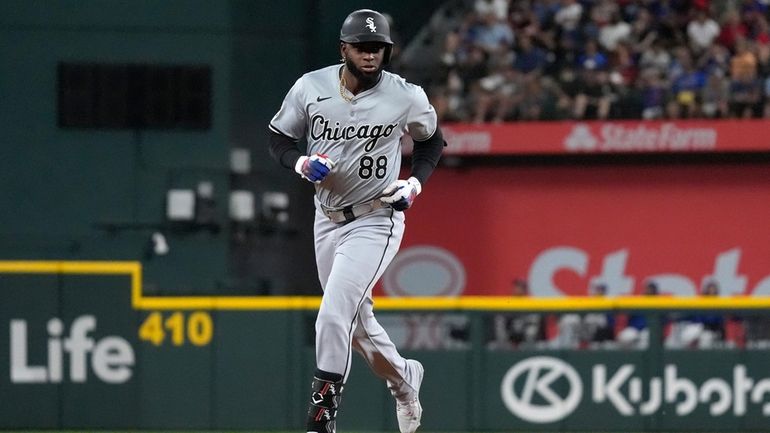 Chicago White Sox's Luis Robert Jr. runs the bases after...