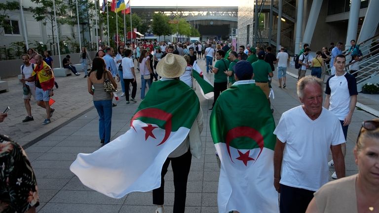 Fans of Algeria arrive ahead of Algeria's Imane Khelif fight...