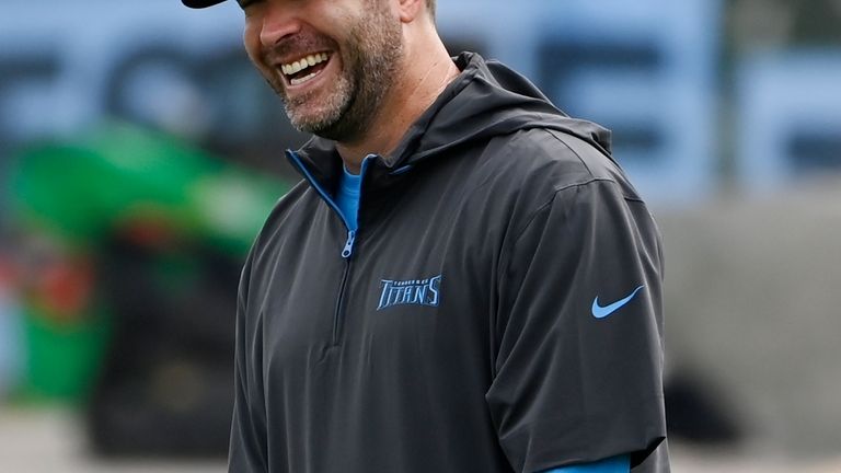 Tennessee Titans head coach Brian Callahan laughs while talking to...