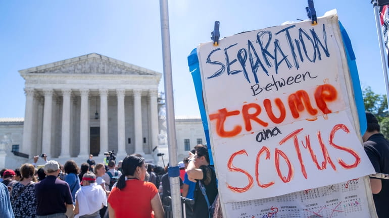 People protest, Monday, July 1, 2024, outside the Supreme Court...