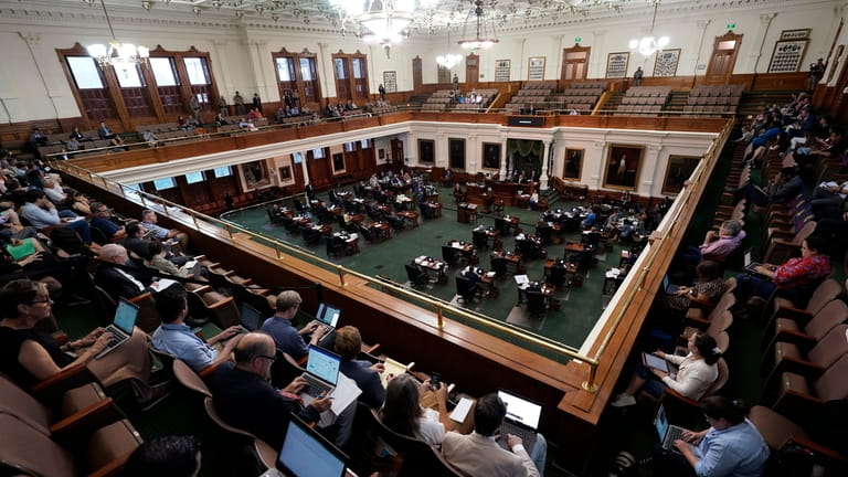 Texas state senators acting as jurors vote on the articles...