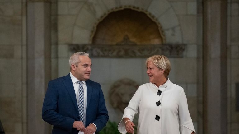 Fairmont Chateau Laurier General Manager Genevieve Dumas, right, speaks with...