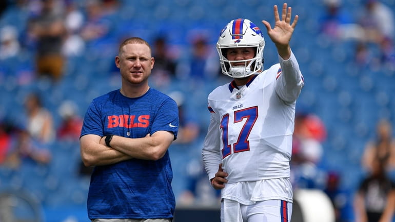 Buffalo Bills quarterback Josh Allen, right, talks with then-quarterbacks coach...