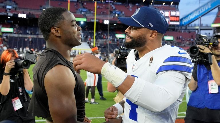 Cleveland Browns' Amari Cooper, left, and Dallas Cowboys' Dak Prescott,...