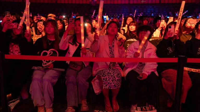 Fans of Chinese rappers including Boss X react during a...