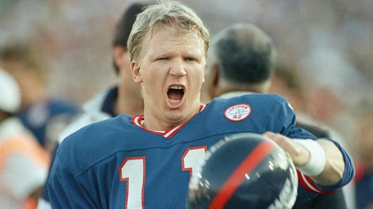 New York Giants quarterback Phil Simms reacts to penalty on...