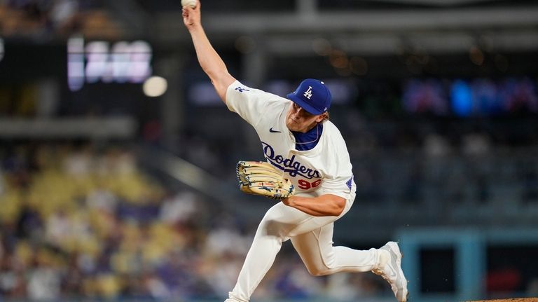 Los Angeles Dodgers starting pitcher Landon Knack throws during the...