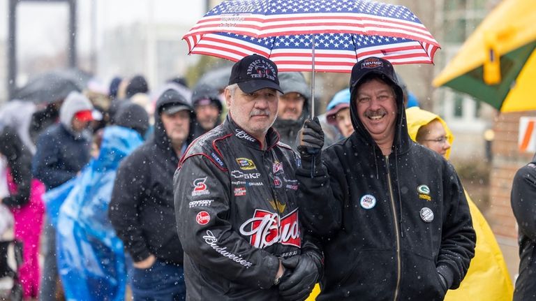 Trump supporters wait in line before Republican presidential candidate former...