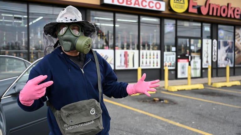 Joseph Charles Amendola, 48, of Seaford, wore a gas mask...