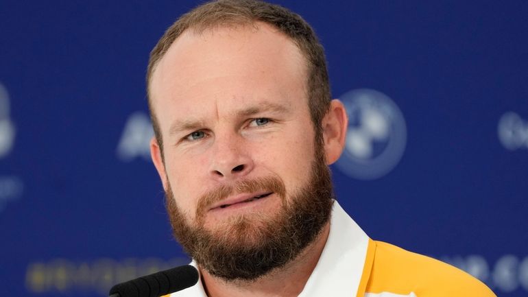 Europe's Tyrrell Hatton meets the journalists during a press conference...